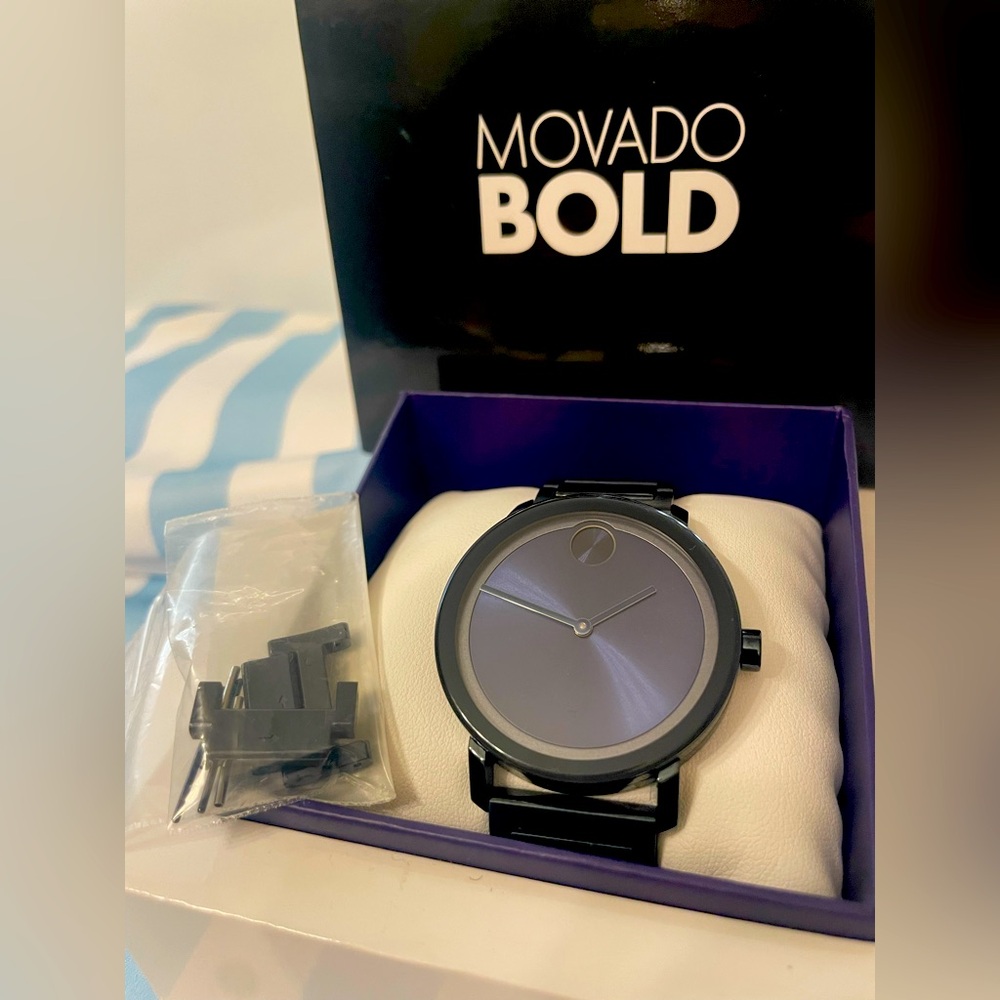 Movado Bold. Sapphire blue. Worn for about a month. Perfect condition. Like new.